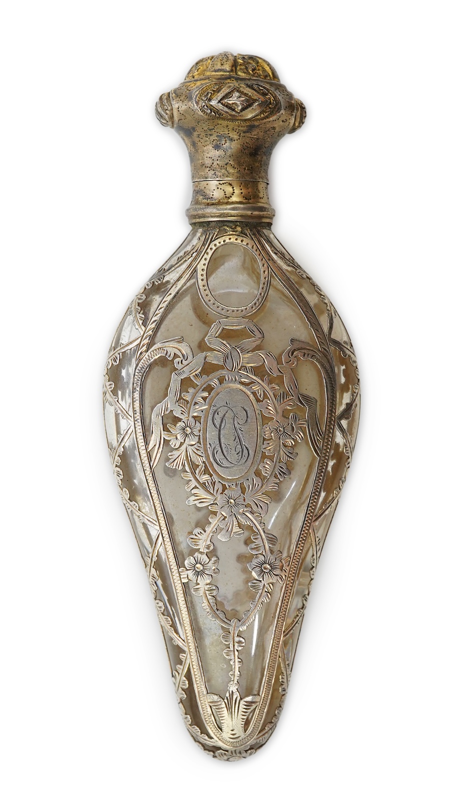 A late 19th century French parcel gilt white metal mounted and overlaid glass scent flask, with hinged cover and glass stopper